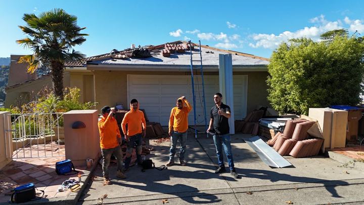 The Precise Roofing crew with owner Yossi Karvani on a tile re roof in the East Bay