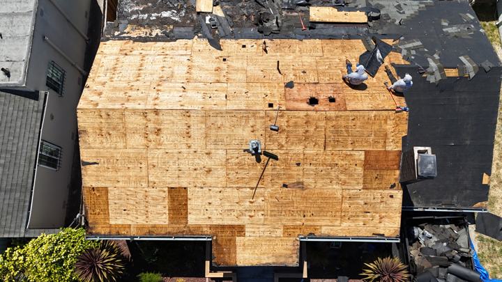 New plywood on a flat section by Precise Roofing