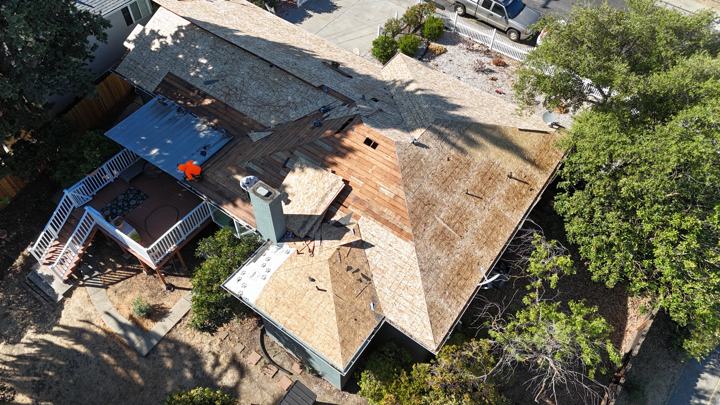 Tarps and crew between storms by Precise Roofing